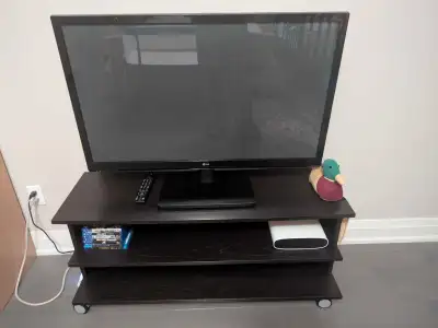 42" LG TV with remote & TV Stand, View more