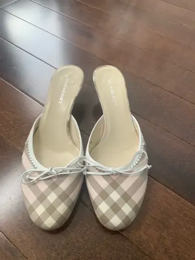 Step out in style with these Burberry women's shoes, featuring a chic plaid pattern and comfortable...