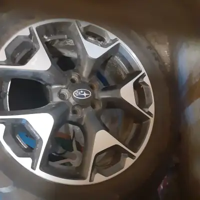 four Subaru rims and tires $475.oo or looking to trade for 235/75 15 ( LT is ok ) winter studded tir...