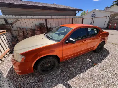 2011 Dodge Avenger - 80,000 km's. Front hood replaced, cosmetic damage to front bumper. Car has A/C,...