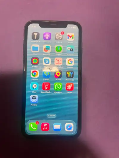Phone 11 for sale Updated IOS 26.2. Comes with case Battery 90%, View more
