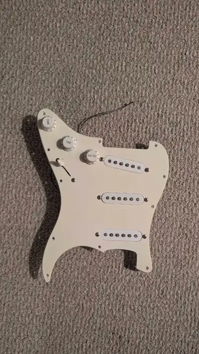Upgrade your guitar with this pre-wired Stratocaster pickguard! This pickguard is fully loaded with...