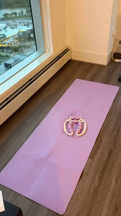 This set includes a light purple yoga mat and a white roller massager with purple rollers. The massa...