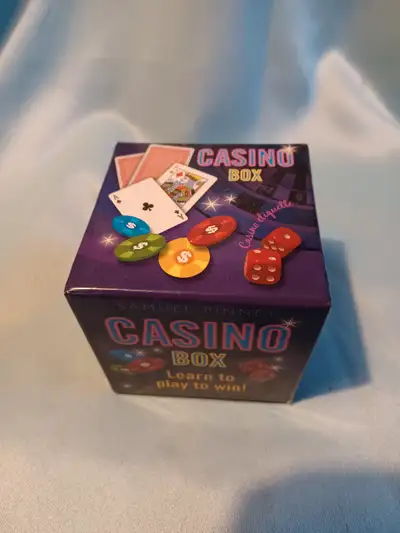 Casino Box. Includes 2 dice. Deck of playing cards, 80 chips and a book of instructions. Learn to Pl...
