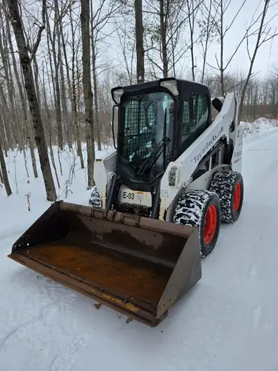 Low hours, spend all of its time on a Deck barge. Has hand and foot controls, Power bobtach, bucket...