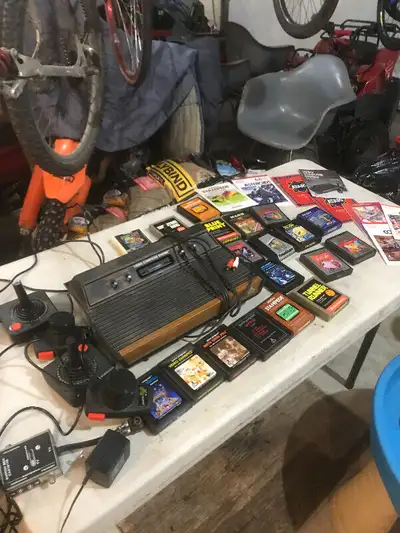Vintage Atari 2600 Wood grain console complete with games, View more