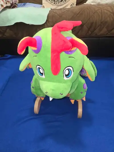 Stuffed dinosaur rocker. Excellent condition from a pet free and smoke free home.
