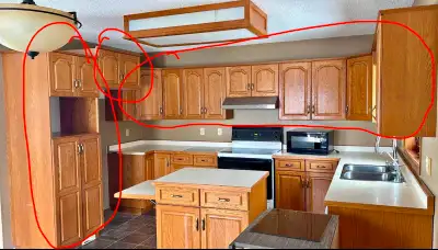 Complete set of Oak upper kitchen cabinets (as shown circled in pic), PLUS large upright cabinet for...