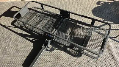 Heavy Duty Cargo Carrier with a 750 lb capacity. 2" hitch. Foldable. Never been used. If the ad is u...