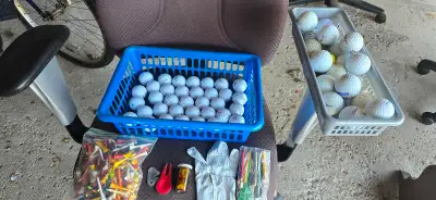 35 new maxfli balls 21 used golf balls 1 left glove I bag of tees 2 divot removers 1 container of ba...