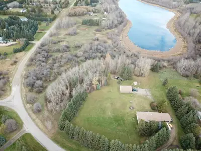 acreage home backing onto a lake mins south of Spruce Grove