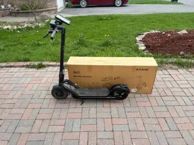 Navee N65 electric scooter, the scooter is in good condition and it has a big battery. The new one i...