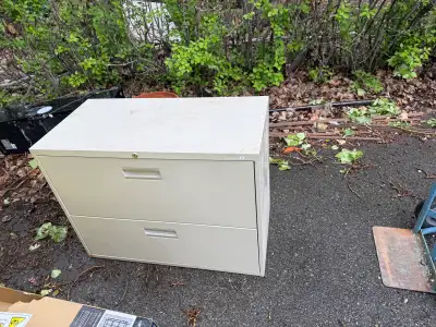 Metal filing cabinet with two storage draws Some rust on back base