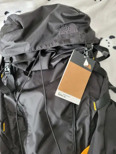 The northface 55 litre with hard wire frame, never used, tags still attached. Back size is large/xla...