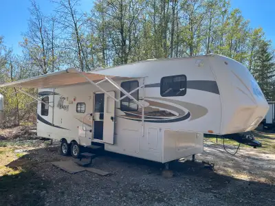 Full shower sleeps 4 very roomy with lots of storage very well kept. Large fridge power awning and j...