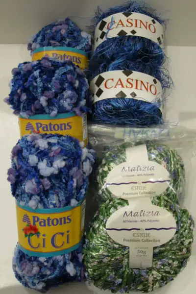 PRICE IS FIRM AND WILL NOT BE LOWERED. Three balls of Patons "Cici", medium and light blues mixed wi...