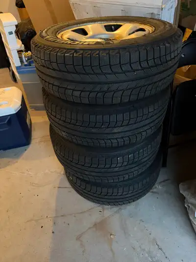 Michelin X ice winter tires on rims 235/65R/17. Barely used as you can see from the tread. Got them...