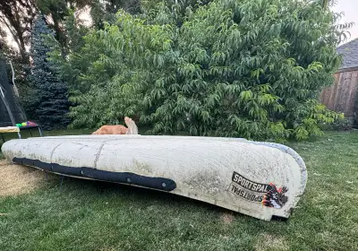 14 foot Sportspal canoe with motor and lots of other accessories. O.b.o