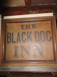 Antique 'Black Dog Inn' sign