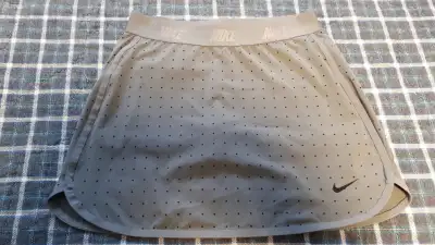 Nike Skort, Size small (size 10/12) Grey with navy dots and logo Excellent condition