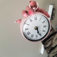 Retro pink circular hanging clock