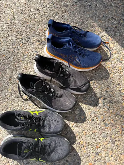 Three pairs of men’s Asics running shoes, View more
