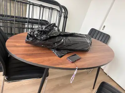 Selling Brown Oval Dining Room Table with 4 Black Chairs, View more