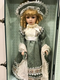 Two identical Vintage porcelain dolls by Collectors Choice 