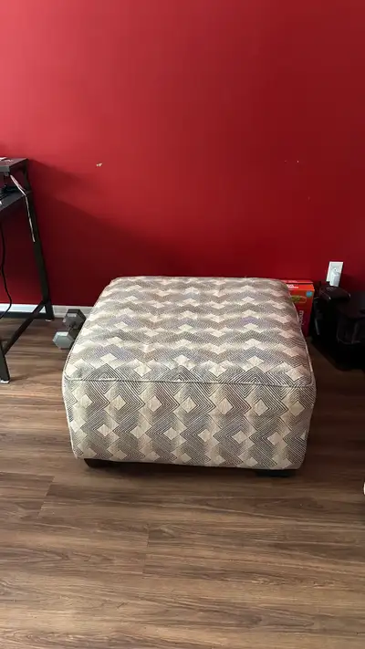 Your cozy corner of the world isn't complete without this oversized ottoman in slate gray. Wrapped i...