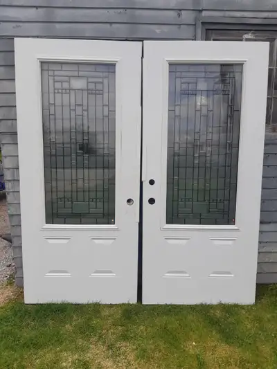 New doors with leaded glass, never used , had them in storage. No frame or hardware door sweeps incl...