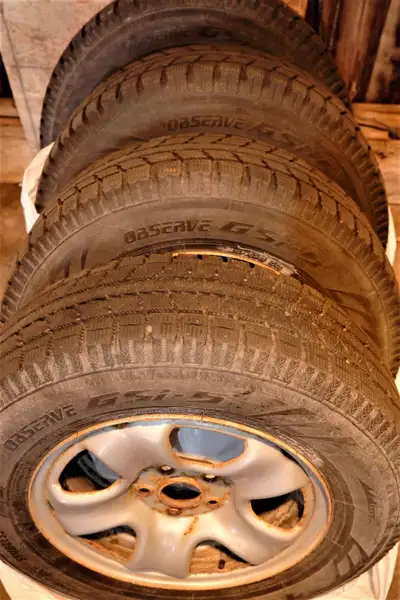 Four 215/70R16 TOYO Observe GSI-5 winter tires on Honda CRV rims. 8-9/32 even tread remaining, very...