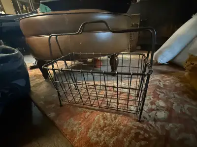 This metal basket is great for holding magazines, small blankets, or toys. It is in good condition w...