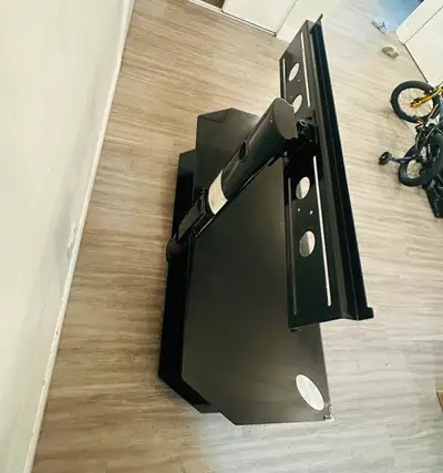 Sleek and sturdy black TV stand with built-in mount, perfect for a clean and modern setup. Ideal for...