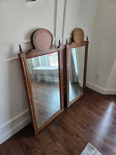 Enhance your home decor with these elegant wooden framed mirrors, each featuring a unique oval top d...