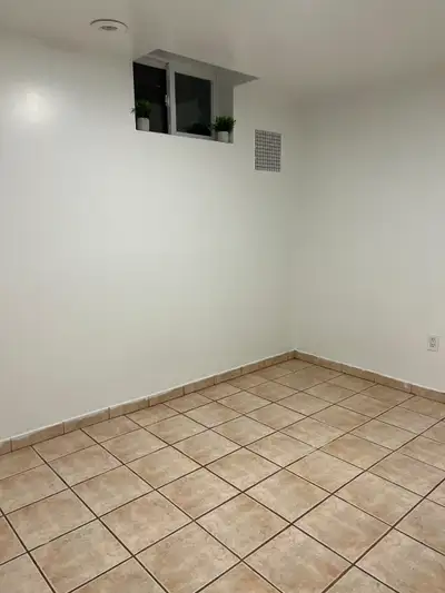 Three bedrooms basement with large Living Space Kitchen, laundry in the unit - two rooms are empty P...