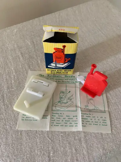 This is a vintage handy little Mother's helper needle threader. The box is in good condition with mi...