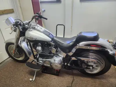 2003 Harley Davidson 100th Anniversary Fat Boy, 148 km. Black and Grey special edition paint. Like n...