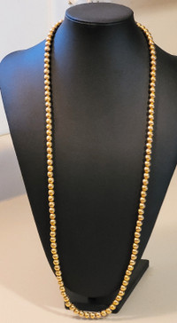 Vintage 1970-80's Monet Necklace is 30" long  Golden Beads.