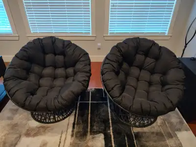 2 papasan(moon) chairs that swivel, 4 months old. 2 sets of cushions included. Black cushions haven’...
