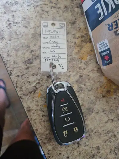 This is a pre-owned authentic Chevrolet key fob compatible with a 2023 Chevy Malibu LS, perfect if y...