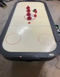 Cooper air hockey table with pucks and paddles