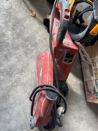 Hilti concrete saw attached to vacuum 