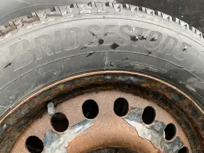Set of 4 Bridgestone Winter tires on steel rims 235/60/17. Has 90% tread. Only used for one season....