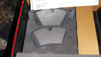 Two brake pads for a 2004 BMW