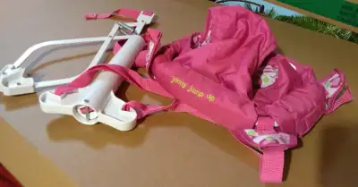 Portable infant exerciser provides entertainment and exercise for baby without taking up floor space...