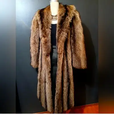 Beautiful full length vintage raccoon coat, mint condition except for one mussing clasp as seen in p...