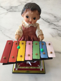 Wind–up Tin Toy Girl Playing a Xylophone