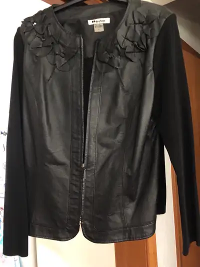 Black leather bomber style jacket. Size Large. 100 percent leather, 92 percent rayon, 8 percent nylo...
