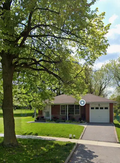 This property is uniquely situated, surrounded on three sides by a beautiful treed park, offering a...