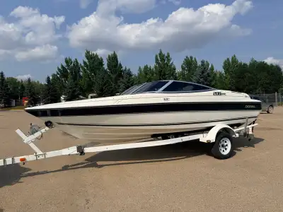 Well-maintained Doral 208BR bowrider boat with a white fiberglass hull and dark green accents. Comes...